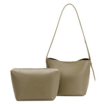 A sage recycled vegan leather shoulder bag with an adjustable strap and a zip pouch.