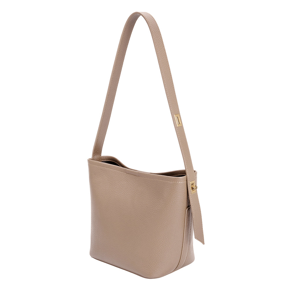 A taupe recycled vegan leather shoulder bag with adjustable strap. 