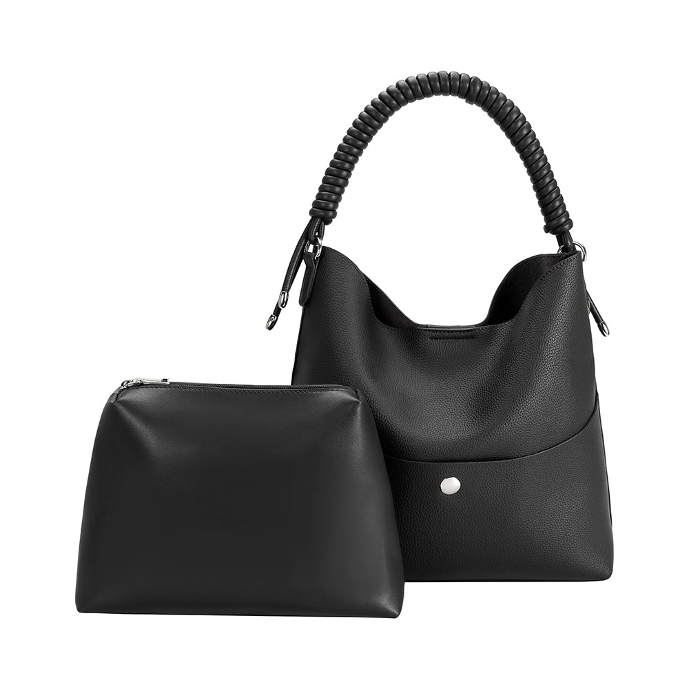 A black pebble vegan leather tote bag with a spiral handle and zip pouch.