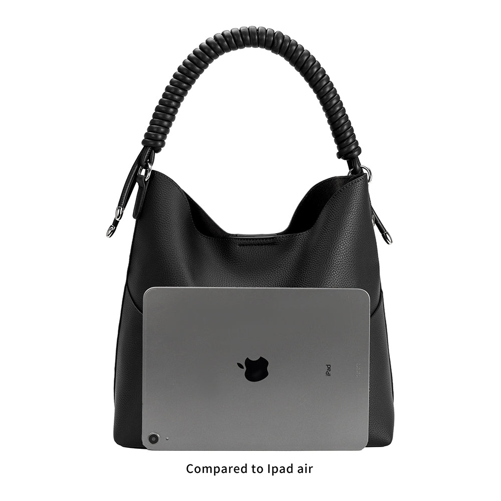 A ipad size comparison image for a pebble vegan leather tote bag with a spiral handle. 