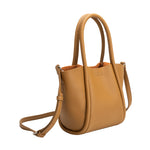 A small tan recycled vegan leather tote bag.