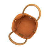 A small tan recycled vegan leather tote bag.