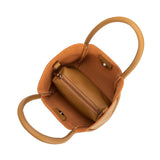 A small tan recycled vegan leather tote bag.