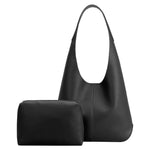 A large black recycled vegan leather shoulder bag with a zip pouch.