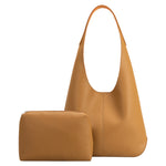 A large tan recycled vegan leather shoulder bag.
