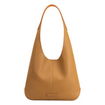 A large tan recycled vegan leather shoulder bag.