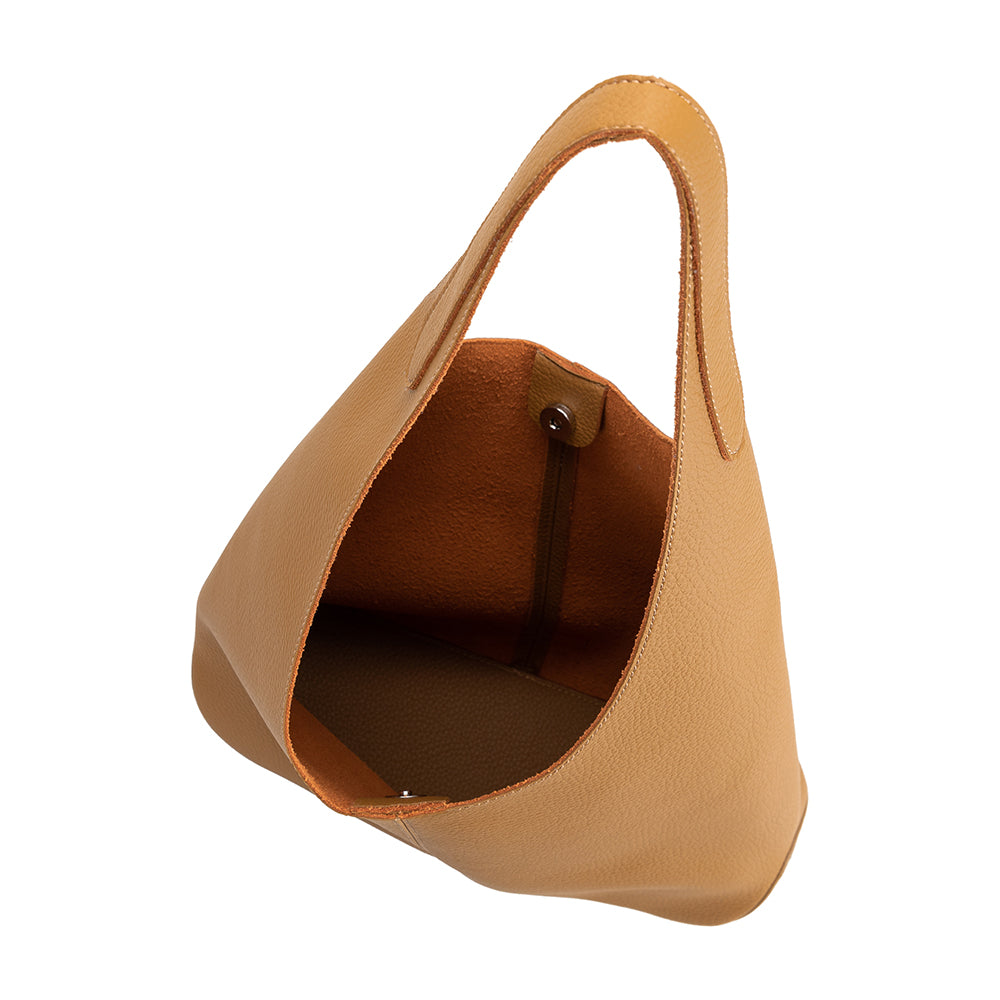 A large tan recycled vegan leather shoulder bag.