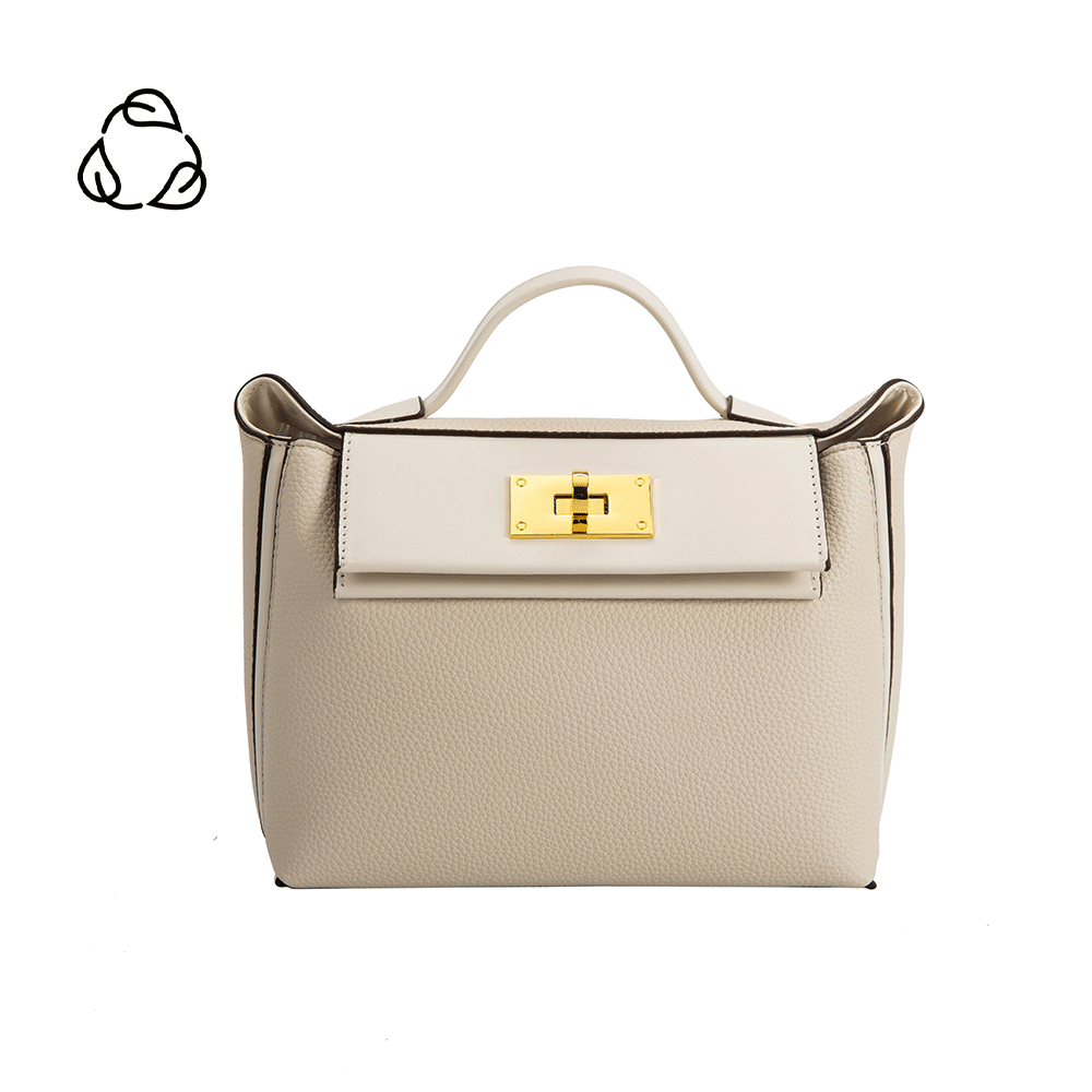 A medium ivory recycled vegan leather crossbody bag with gold hardware. 