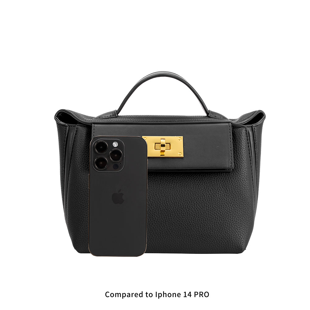 An iphone 14 pro size comparison image for a medium black crossbody bag with gold hardware.