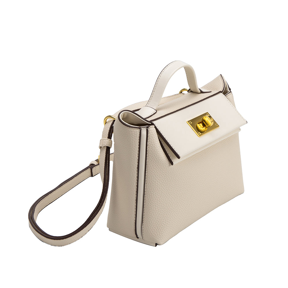 A medium ivory recycled vegan leather crossbody bag with gold hardware. 