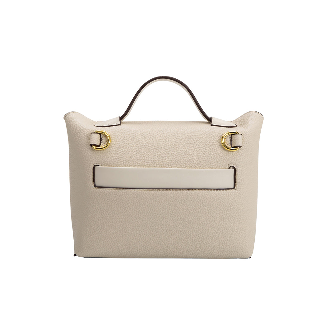 A medium ivory recycled vegan leather crossbody bag with gold hardware.