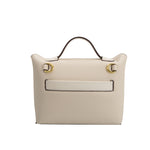 A medium ivory recycled vegan leather crossbody bag with gold hardware.