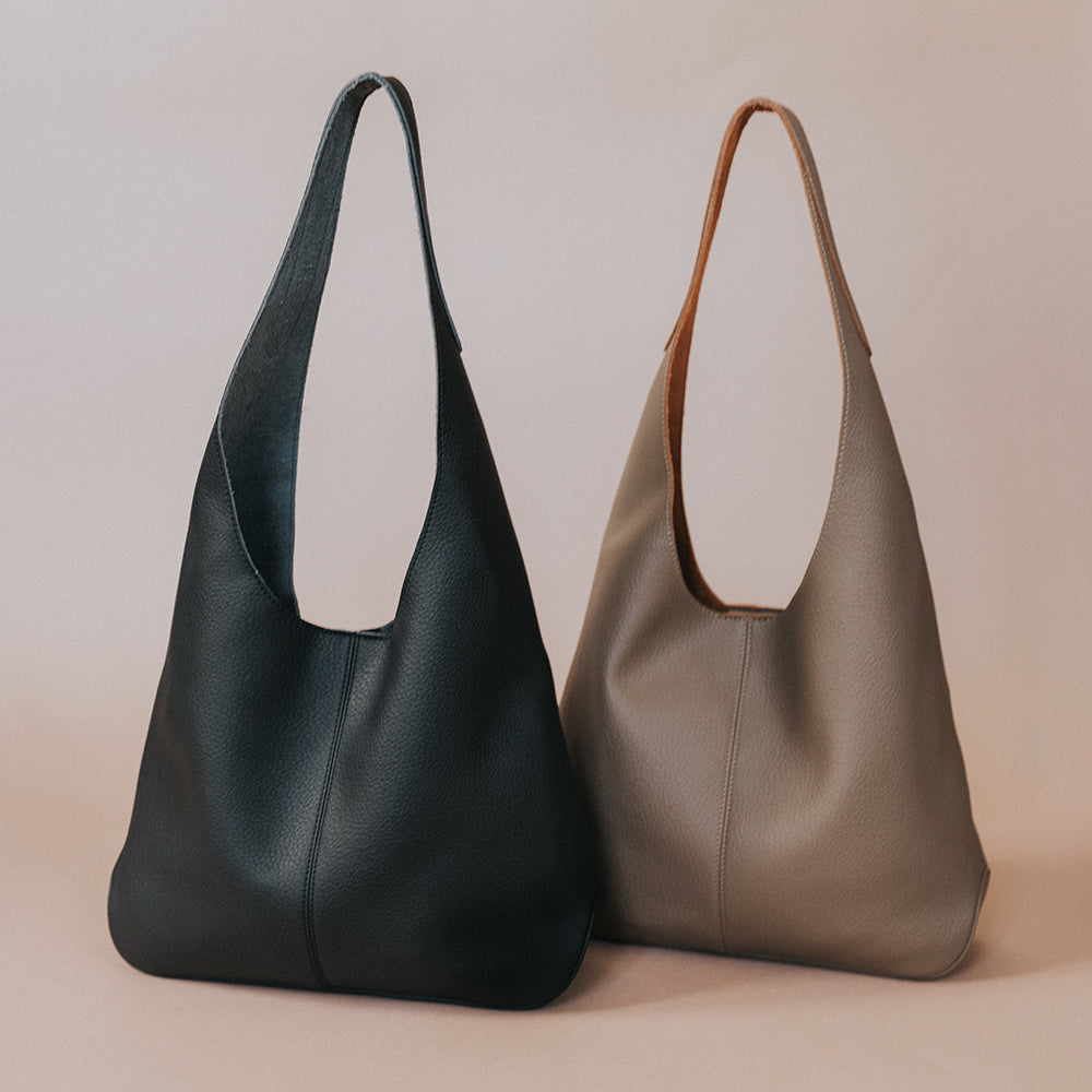 A still image of two large recycled vegan leather shoulder bag.