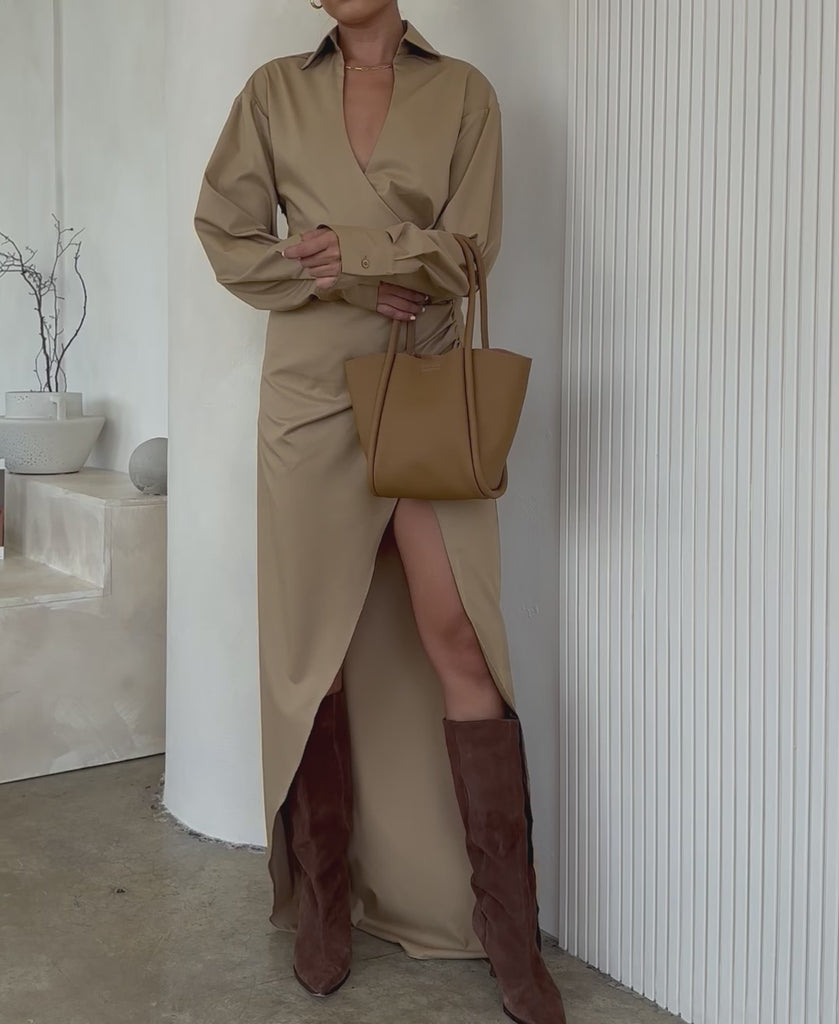 Video of a model wearing a small recycled vegan leather tote bag.