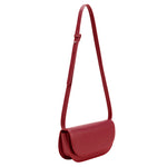 A small red vegan leather shoulder bag with a scalloped strap.