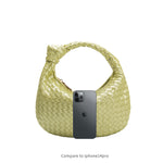An iphone 14 size comparison image for a small woven top handle bag with a knot