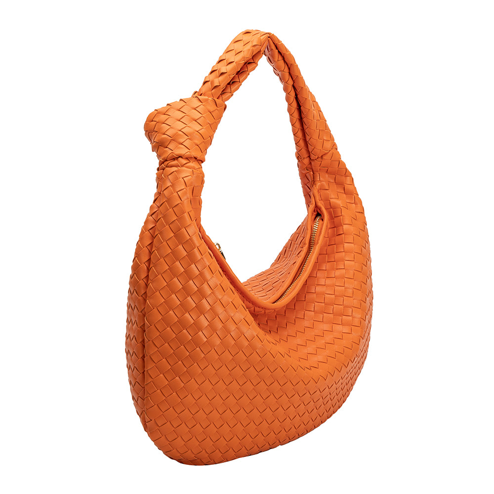 A large orange woven vegan leather shoulder bag with a knot handle.
