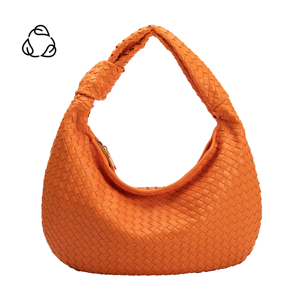 A large orange woven vegan leather shoulder bag with a knot handle.
