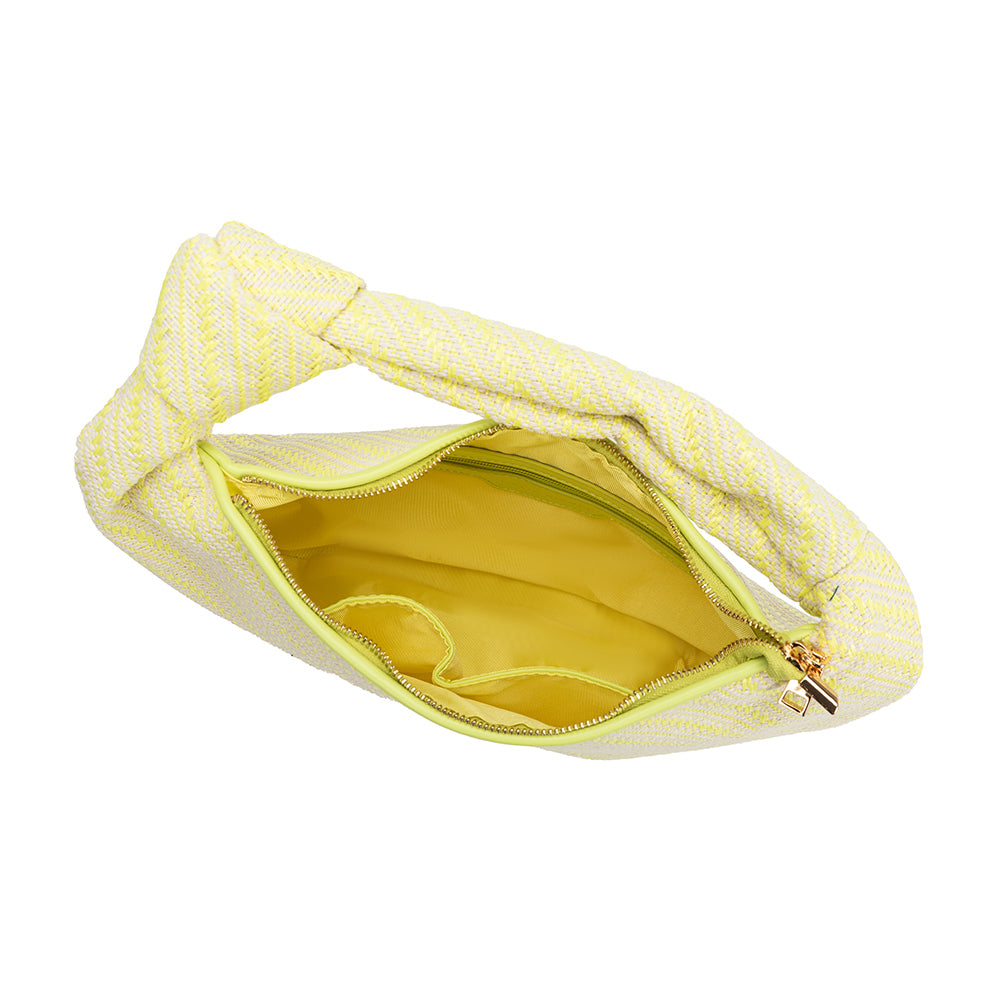 A large yellow straw woven shoulder bag with a knot handle