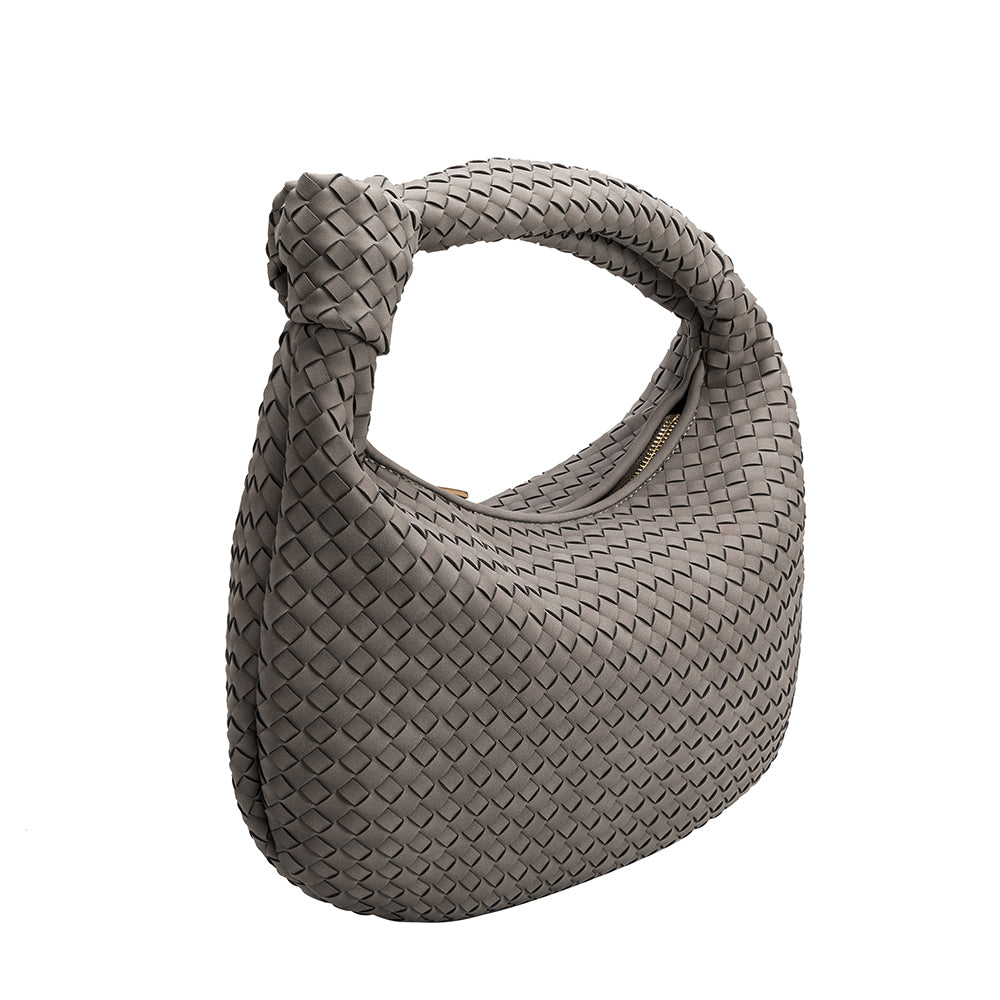 A storm suede recycled vegan leather shoulder bag with a knot. 