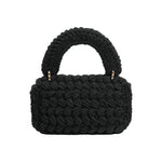 A black knitted crossbody handbag with a gold clasp.