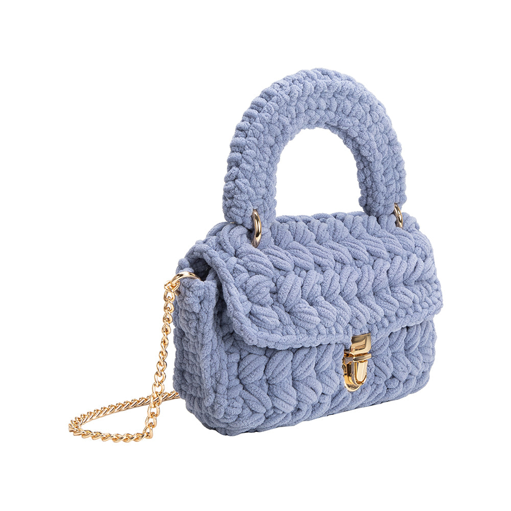 A sky knitted crossbody handbag with gold clasps.