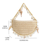 A measurement reference image for a small crochet straw top handle bag with a seashell details along the handle.