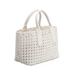 A small white woven vegan leather top handle bag with a drawstring closure.