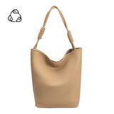 A large nude vegan leather tote bag with a knotted handle.