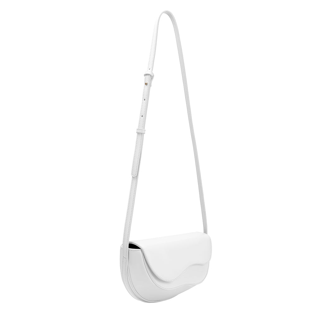 A small white vegan leather crossbody bag with a wavy front flap closure.
