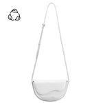 A small white vegan leather crossbody bag with a wavy front flap closure.