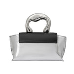 A small metallic vegan leather top handle bag with a wavy black front flap closure.