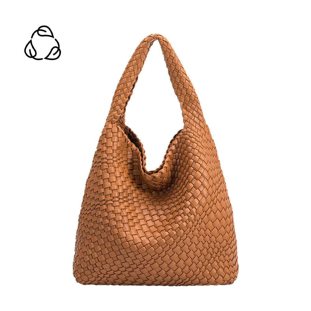 A large saddle woven vegan leather shoulder bag.