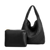 A large black woven vegan leather shoulder bag with a zip pouch.
