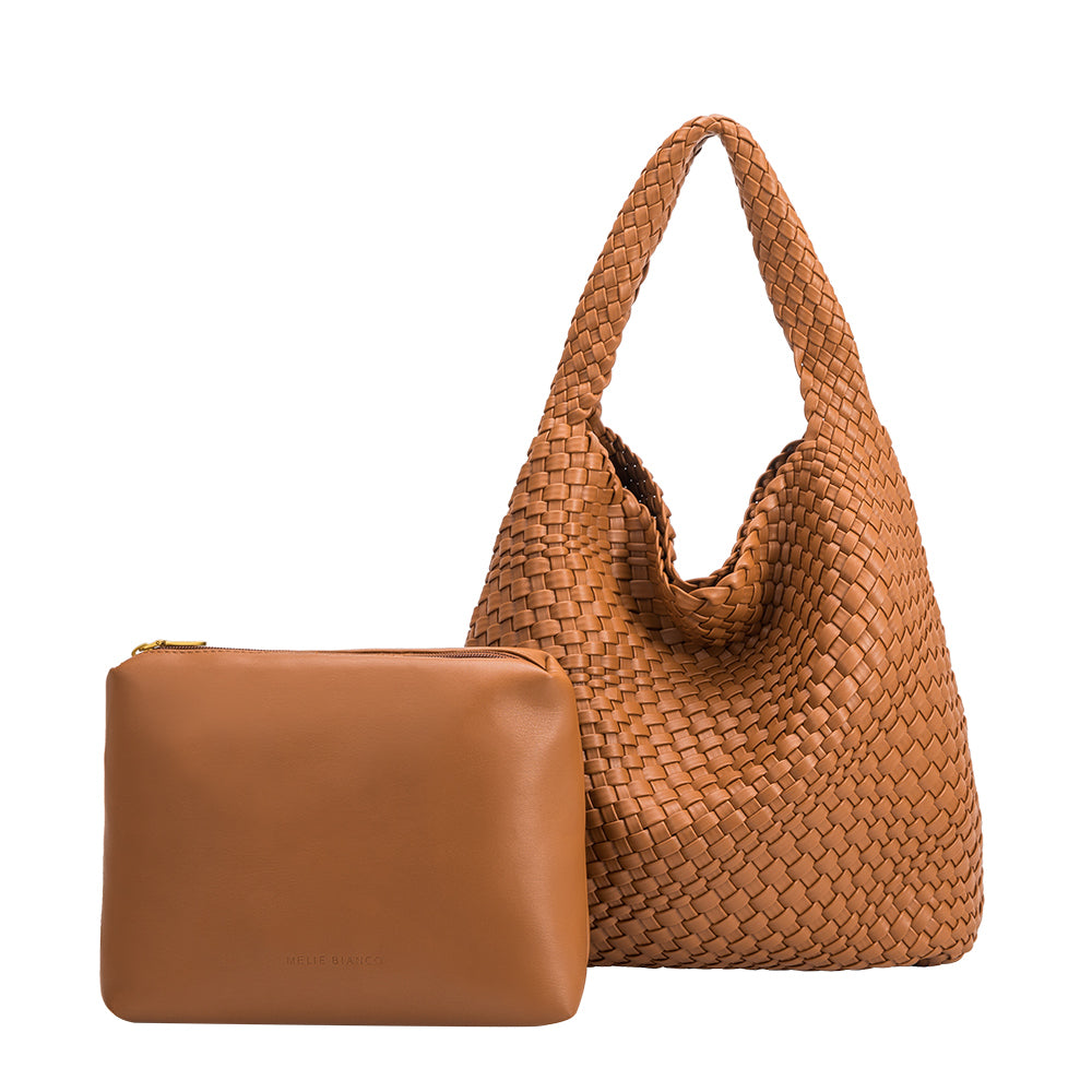 A large saddle woven vegan leather shoulder bag with a zip pouch.