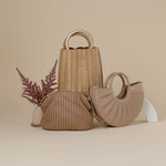 Melie Bianco Recycled Vegan Leather Lily Small Top Handle Bag in Tan, Recycled Vegan Leather Ava Small Crossbody Bag in Nude, and Luxury Vegan Leather Karlie Top Handle Bag in Nude