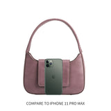 An iphone 11 pro size comparison image for a small vegan leather shoulder bag with a wrapped handle. 