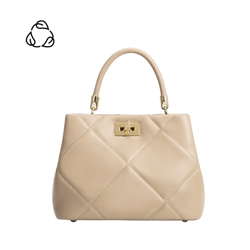 A mushroom crossbody handbag with gold clasp.