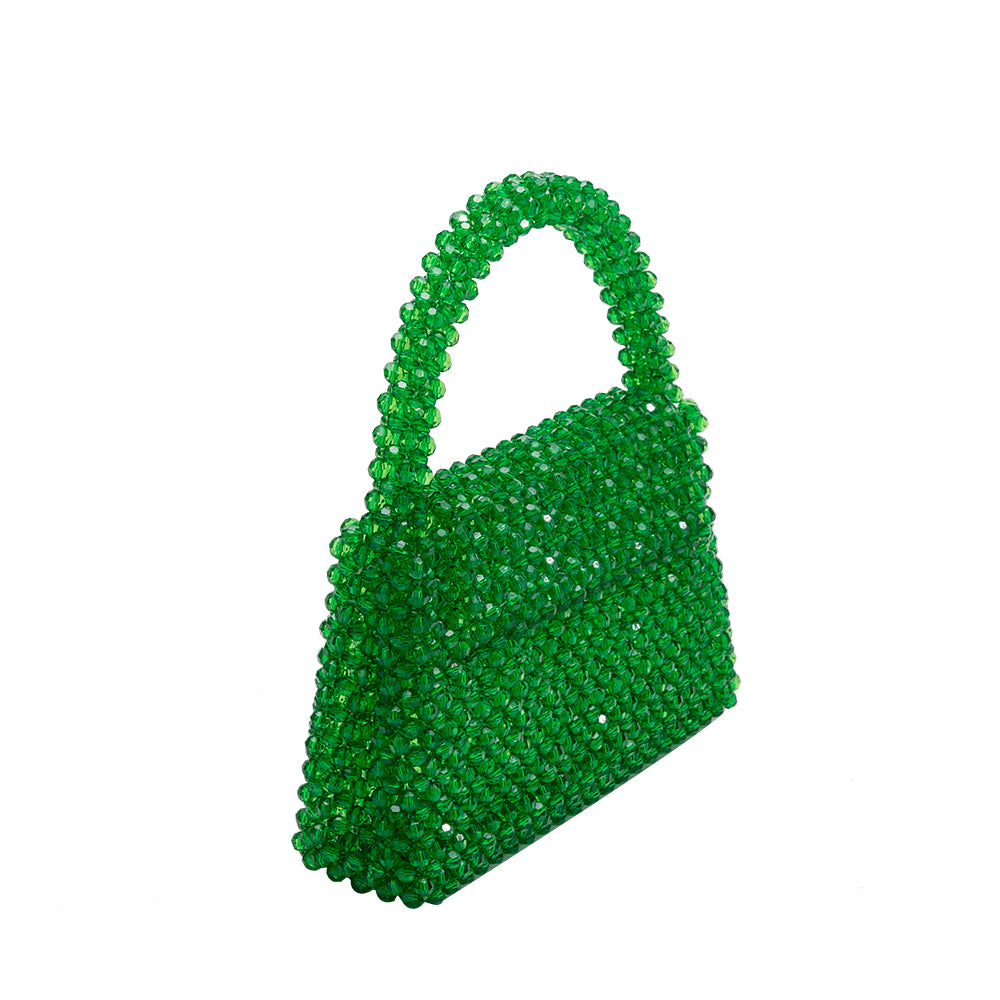 A small emerald crystal beaded top handle bag with a flap closure. 