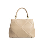 A mushroom crossbody handbag with gold clasps.