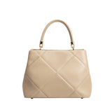 A mushroom crossbody handbag with gold clasps.