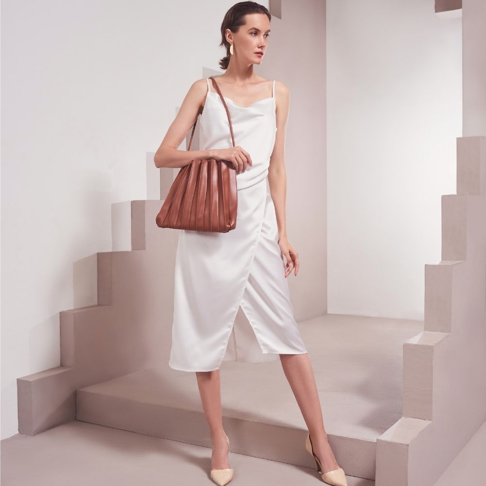 Model Wearing Melie Bianco Carrie Pleated Luxury Vegan Leather Shoulder Bag in Saddle