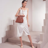Model Wearing Melie Bianco Carrie Pleated Luxury Vegan Leather Shoulder Bag in Saddle
