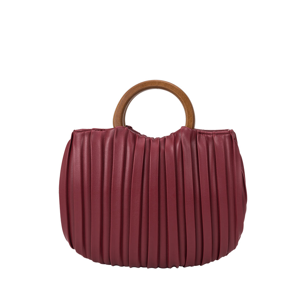 A small burgundy vegan leather crossbody bag with pleated detail and a wooden handle.