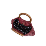 A small burgundy vegan leather crossbody bag with pleated detail and wooden handle. 