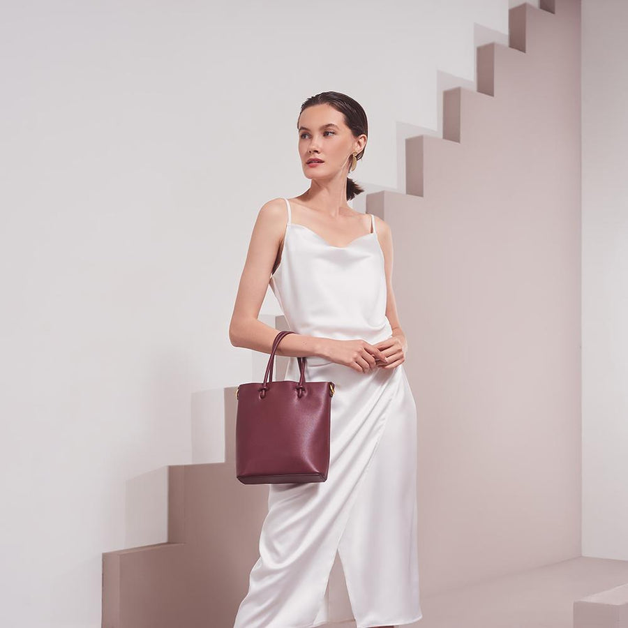 Model Wearing Melie Bianco Luxury Vegan Leather Bailey Crossbody Bag in Burgundy