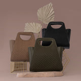 A still image of three woven recycled vegan top handle bag against a taupe background. 