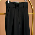 A still image of a black straight leg pant on a hanger close up image. 
