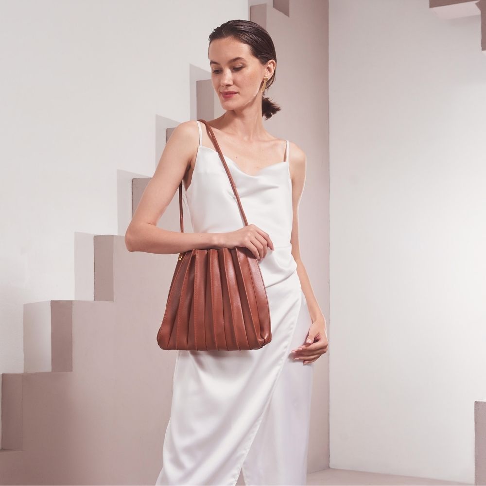 Model Wearing Melie Bianco Carrie Pleated Luxury Vegan Leather Shoulder Bag in Saddle