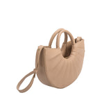 A small nude semi circle vegan leather top handle with pleated detail.